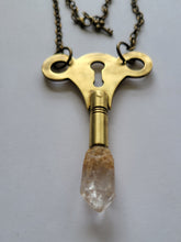 Load image into Gallery viewer, Antique Brass Clock Key with Clear Skeletal Root Quartz Handmade OOAK
