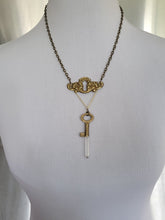 Load image into Gallery viewer, Antiuque Brass Escutcheon and Antique Brass Key with Hand Fitted Columbian Quartz Handmade OOAK
