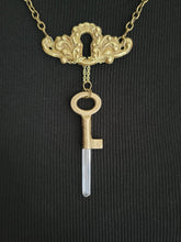 Load image into Gallery viewer, Antiuque Brass Escutcheon and Antique Brass Key with Hand Fitted Columbian Quartz Handmade OOAK
