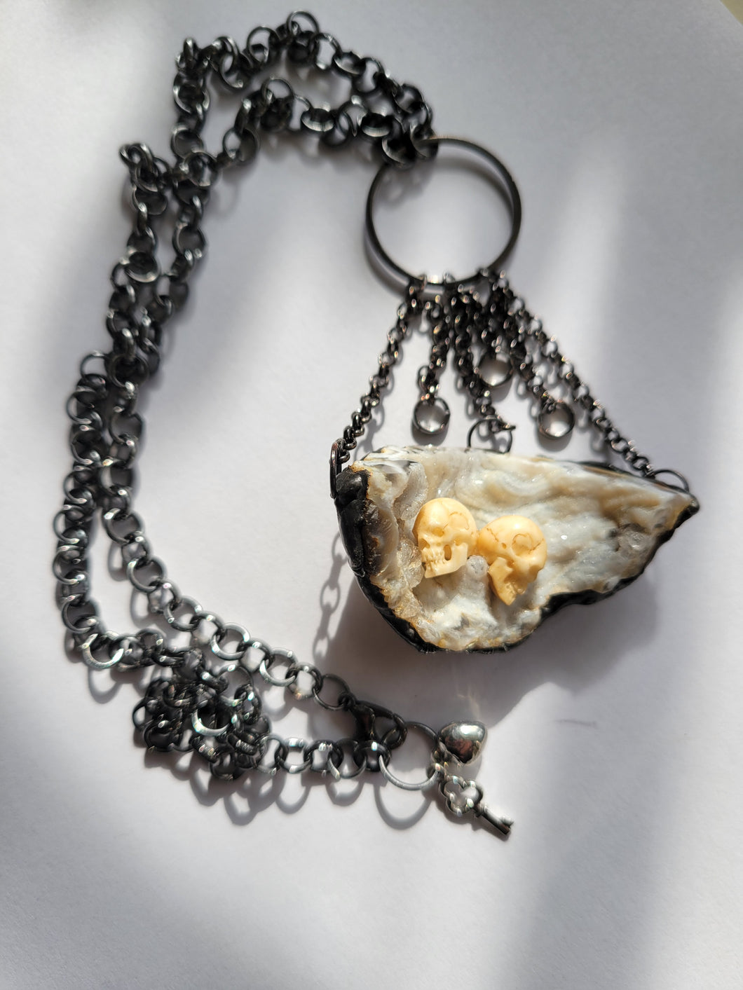 Druzy Agate with Two Carved Bone Skulls 